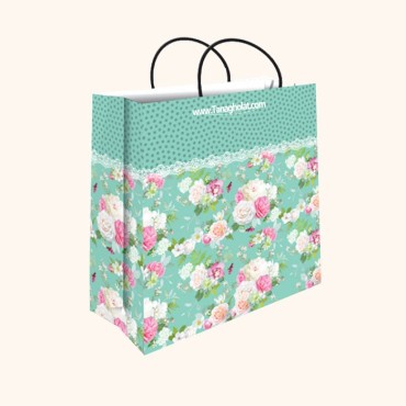 ساک کادویی بزرگ سایز 5 طرح گل های ریز صورتی و سفید با زمینه سبز